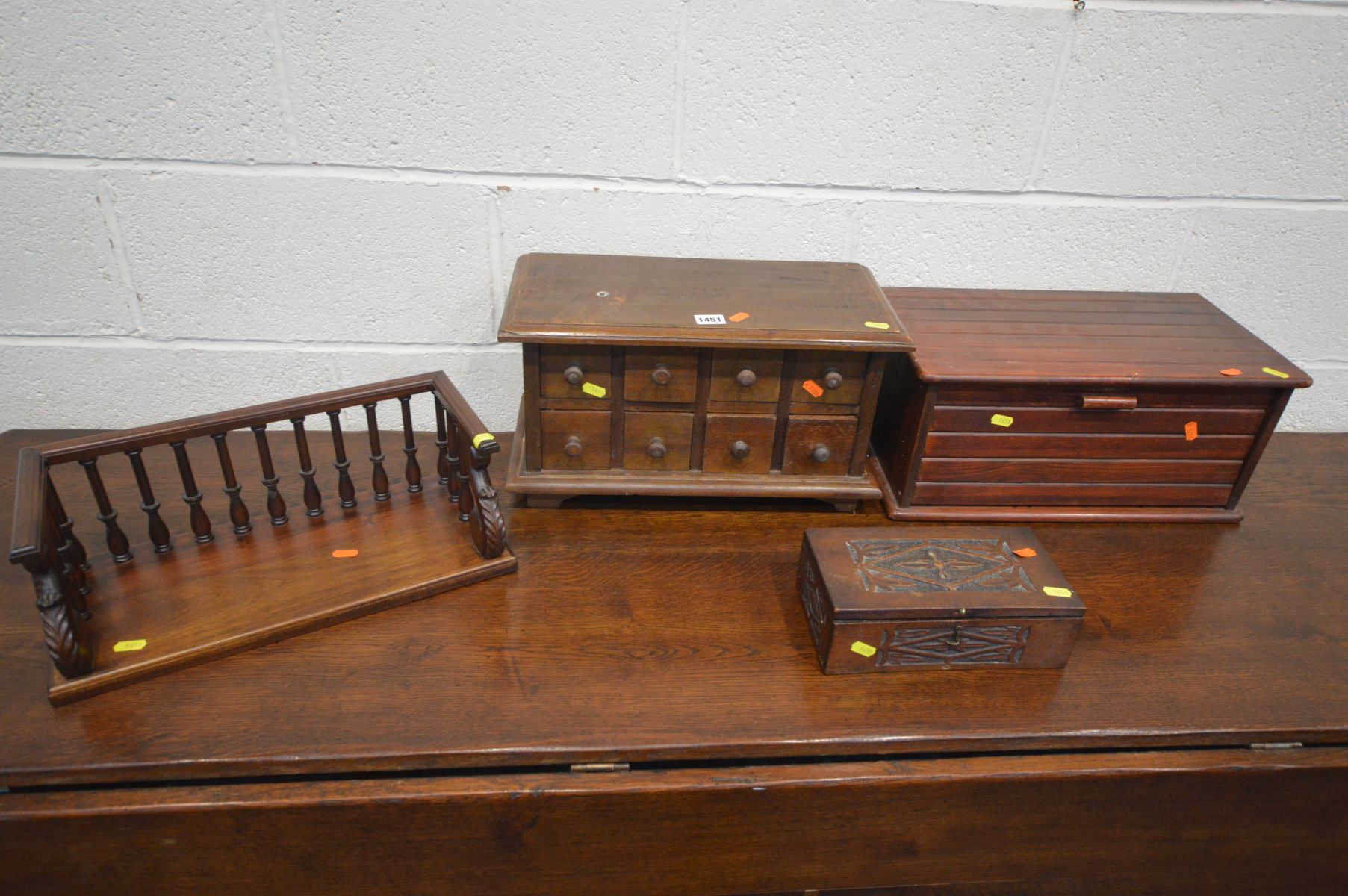 A TABLE TOP CHEST OF EIGHT MINIATURE DRAWERS, along with a stained wood bread bin, a hardwood