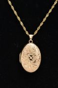 A 9CT GOLD LOCKET NECKLACE, the locket of an oval form, embossed floral design to the front, opens