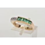 A YELLOW METAL EMERALD AND DIAMOND RING, half eternity style ring, with one half set with five