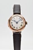 AN EARLY 20TH CENTURY 9CT GOLD WATCH WITH LEATHER STRAP, the circular head with white face and Roman