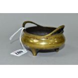 A SMALL CHINESE BRONZE CENSER, of circular form with loop handles, bears six character mark to the