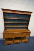 AN 18TH CENTURY AND LATER PINE DRESSER, with triple tier plate rack, above a base with three