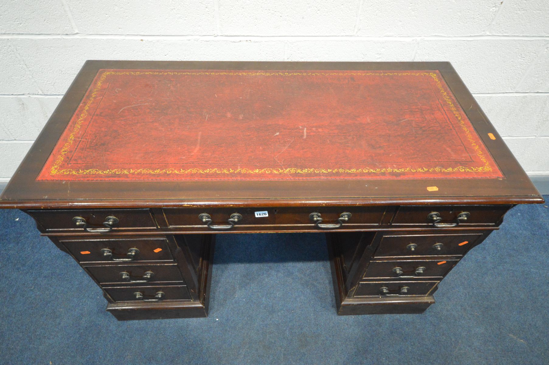 A MAHOGANY PEDESTAL DESK, with oxblood and gilt tooled leather inlayed top and seven assorted - Image 2 of 3