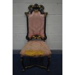 A LOUIS XV STYLE EBONISED AND GILT HIGH BACK CHAIR, with distressed pink floral upholstery (this