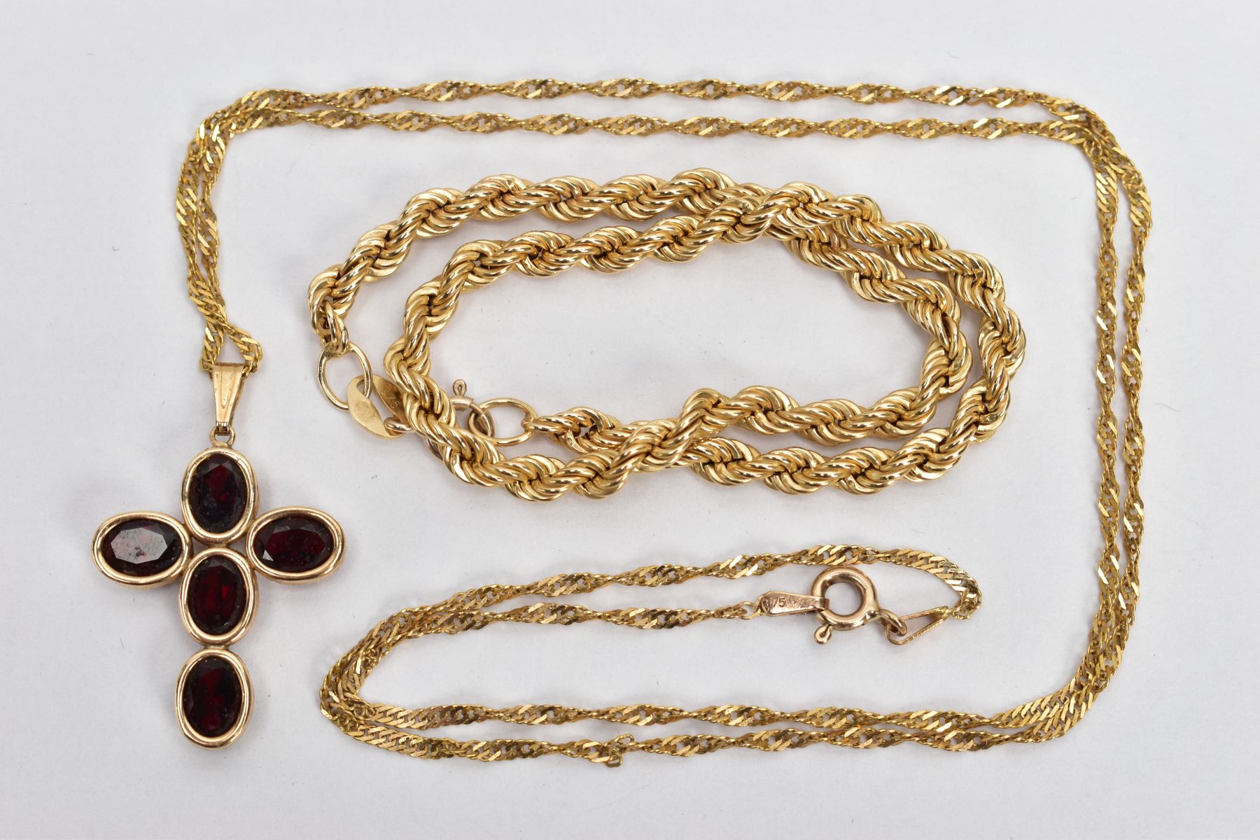 A 9CT GOLD ROPE TWIST BRACELET AND A GARNET CROSS PENDANT NECKLACE, hollow rope twist bracelet