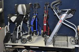 A KARMA MOBILITY FOLDING WHEELCHAIR, a Days mobility walker, a Z-Tec Mobility walker and a Trust