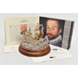 A ROYAL MINT SILVER MODEL OF THE 'GOLDEN HIND', mounted atop of a wavey sea detailed base signed '