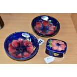 A PAIR OF MOORCROFT POTTERY SHALLOW FOOTED BOWLS AND A SMALL TRINKET BOX AND COVER, all decorated