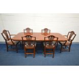 A MAHOGANY TWIN PEDESTAL EXTENDING DINING TABLE, one additional leaf, extended width 214cm x