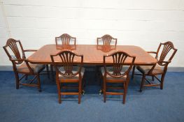 A MAHOGANY TWIN PEDESTAL EXTENDING DINING TABLE, one additional leaf, extended width 214cm x