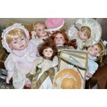 A BOX CONTAINING SEVEN MODERN COLLECTORS DOLLS, four from the Leonardo Collection, together with