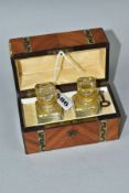 A 19TH CENTURY CASKET SHAPED PERFUME BOX, containing two glass scent bottles with floral gilt