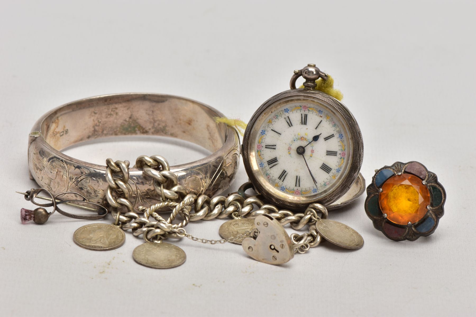 A SELECTION OF SILVER ITEMS, to include a foliate engraved hinged bangle, fitted with a push pin