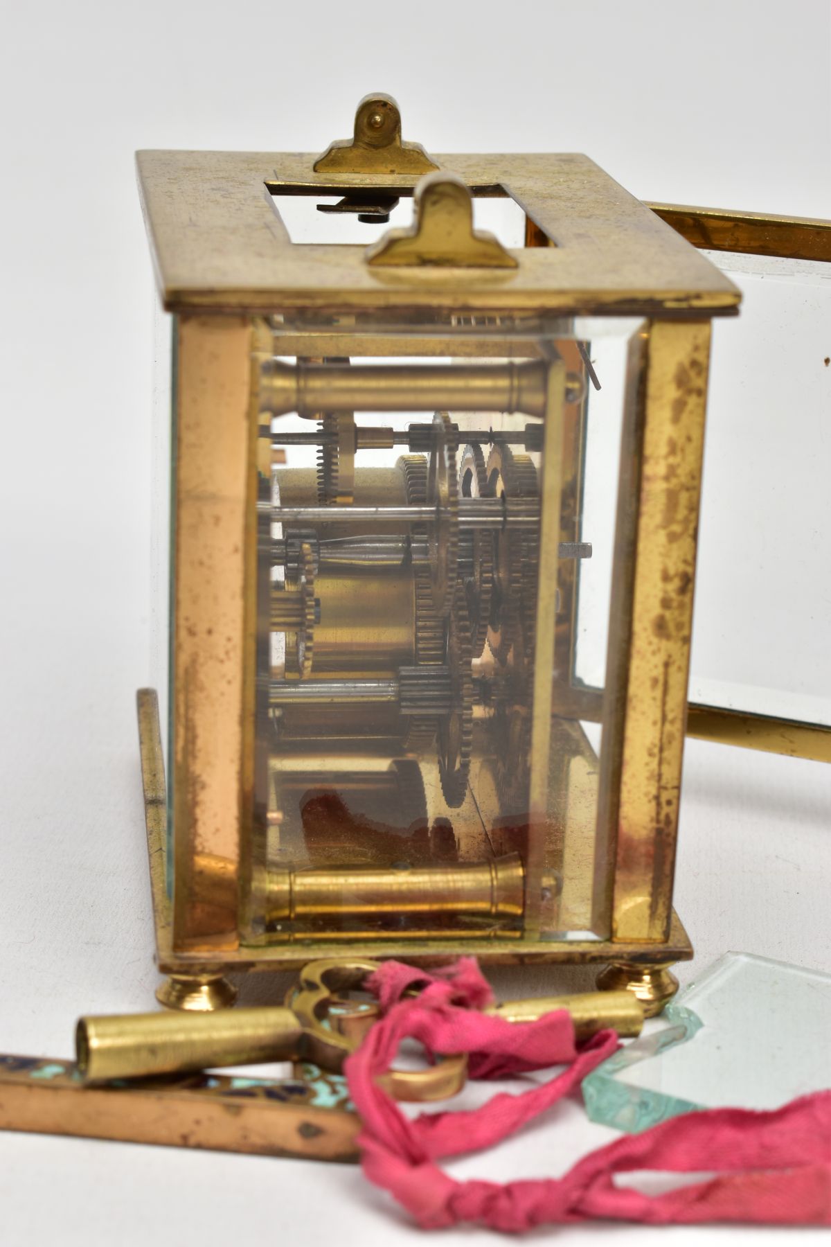 A BRASS AND ENAMELLED CARRIAGE CLOCK, of a square form, round white dial with the centre decorated - Image 5 of 6