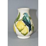 A SMALL MOORCROFT POTTERY BALUSTER VASE IN THE LEMON TREE PATTERN, on a white ground, impressed