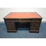 A LARGE REPRODUCTION MAHOGANY PEDESTAL DESK, with a red leather and gilt tooled inlay top, and eight