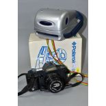 A BOXED POLAROID P-CAM INSTANT CAMERA AND A CANON T70 SLR CAMERA, comprising Canon film camera