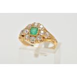 AN EARLY 20TH CENTURY EMERALD AND DIAMOND CLUSTER RING, centring on an AF square cut emerald (