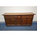 NIGEL GRIFFITHS, A HANDCRAFTED OAK SIDEBOARD, with two long drawers flanking a single short