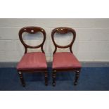 A PAIR OF VICTORIAN MAHOGANY BALLOON BACK CHAIRS