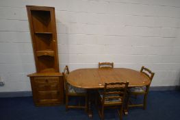 A MODERN OAK PRIORY EXTENDING DINING TABLE with a fold out leaf, extended length 166cm x closed