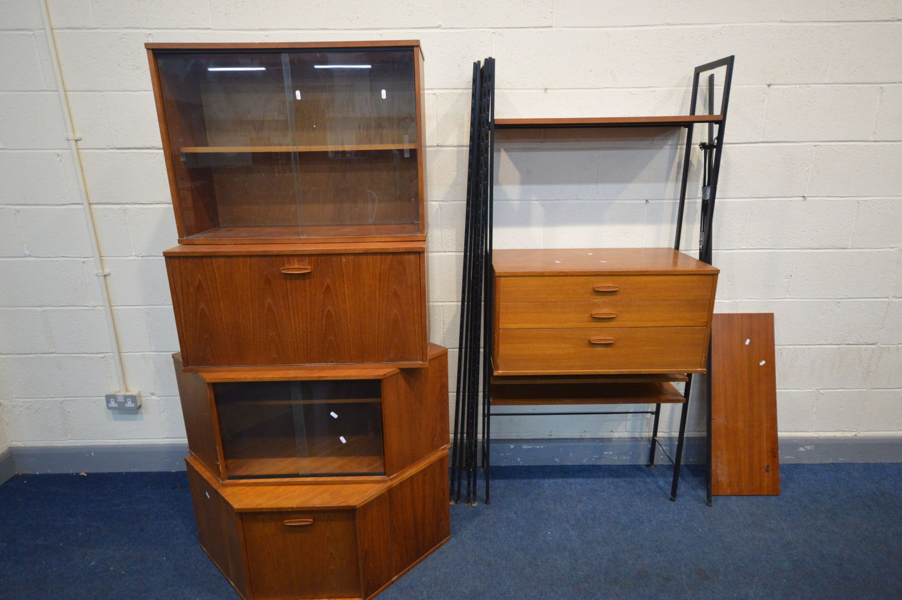 AN AVALON MODULAR TEAK LADDERAX STYLE SHELVING SYSTEM, comprising of six metal uprights, three