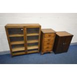 AN OAK GLAZED TWO DOOR BOOKCASE, width 97cm x depth 24cm x height 111cm (lock faulty) along with a