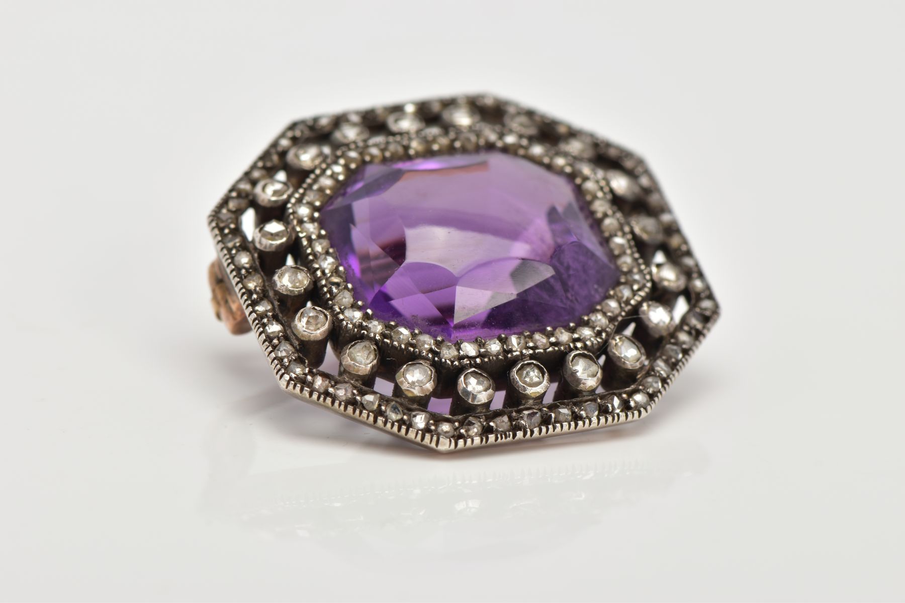 A LATE VICTORIAN AMETHYST AND ROSE CUT DIAMOND BROOCH, centring on a cushion cut amethyst, within an - Image 4 of 5