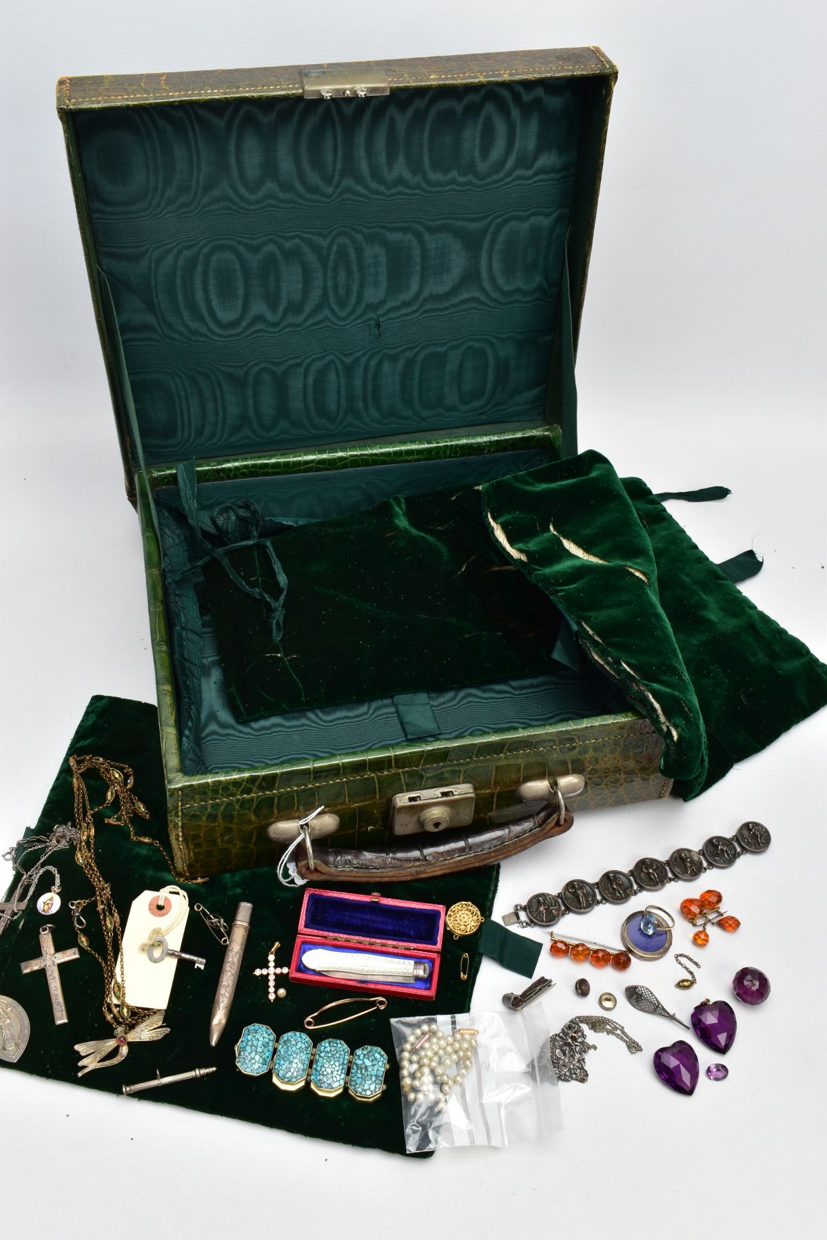 A LEATHER CASE WITH JEWELLERY, green crocodile skin case, with contents to include a gilt silver