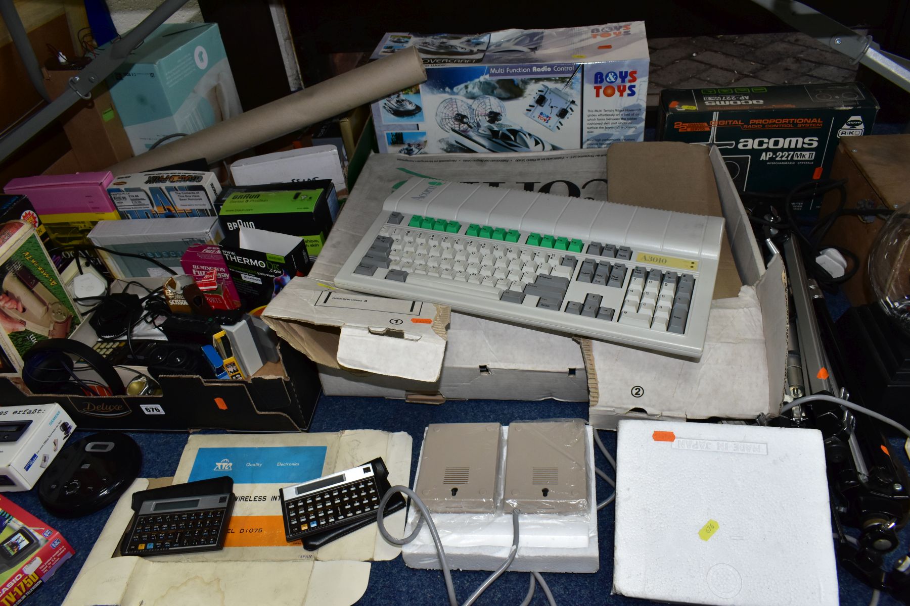 TWO BOXES AND LOOSE ELECTRICAL ITEMS, to include a boxed Acorn A3010 computer, a radio controlled