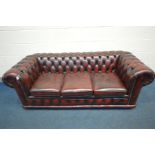 A LEATHER OXBLOOD CHESTERFIELD THREE SEATER SOFA, length 189cm x depth 83cm x height 70cm