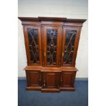 A LARGE REPRODUCTION MAHOGANY BREAKFRONT BOOKCASE, with three astragal glazed bevelled edge doors,