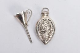 A WHITE METAL SCENT BOTTLE WITH FUNNEL, the bottle decorated with an embossed floral design, with