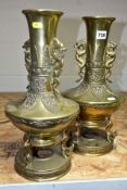 A PAIR OF CHINESE BRONZE VASES, dragon handles to the necks, the vases are raised on three