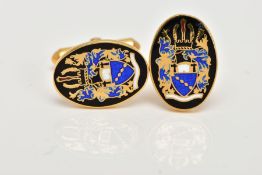 A PAIR OF 9CT GOLD ENAMELLED CUFFLINKS, each of an oval form, decorated with a black, blue, white