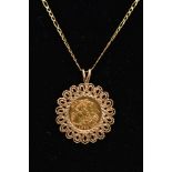 A HALF SOVEREIGN PENDANT AND CHAIN, the 1982 half sovereign within a scalloped 9ct gold mount