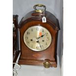 A WESTMINSTER CHIMING BRACKET CLOCK, the mahogany case with lightwood string inlay, the silvered