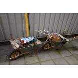 TWO WHEEL BARROWS containing tools including a Silverline double suction pad, spirit levels,