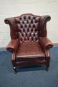 A LEATHER OXBLOOD CHESTERFIELD WINGBACK ARM CHAIR