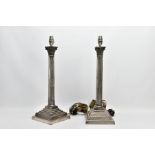 A PAIR OF ELECTROPLATED CORINTHIAN COLUMN LAMPS, each on a square stepped base with beaded detail,