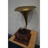 A VINTAGE WINNER WIND UP GRAMOPHONE with a brass horn (condition - brass horn damaged and repairs,