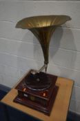 A VINTAGE WINNER WIND UP GRAMOPHONE with a brass horn (condition - brass horn damaged and repairs,