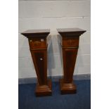 A PAIR OF REPRODUCTION PEDESTAL JARDINIERE STANDS on square tapered supports and a box plinth,