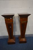 A PAIR OF REPRODUCTION PEDESTAL JARDINIERE STANDS on square tapered supports and a box plinth,