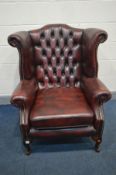 A LEATHER OXBLOOD CHESTERFIELD WINGBACK ARM CHAIR