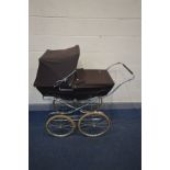 A FOLDING SILVER CROSS PRAM