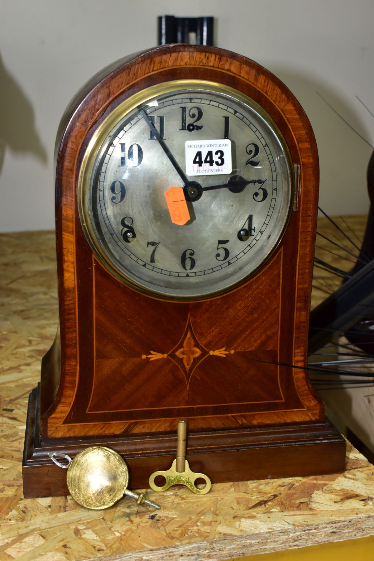 AN EDWARDIAN MAHOGANY AND INLAID MANTEL CLOCK, circular silvered dial with Arabic numerals, eight