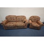 A FLORAL UPHOLSTERED WITH A BROWN FIELD TWO PIECE LOUNGE SUITE, comprising a two seater settee,