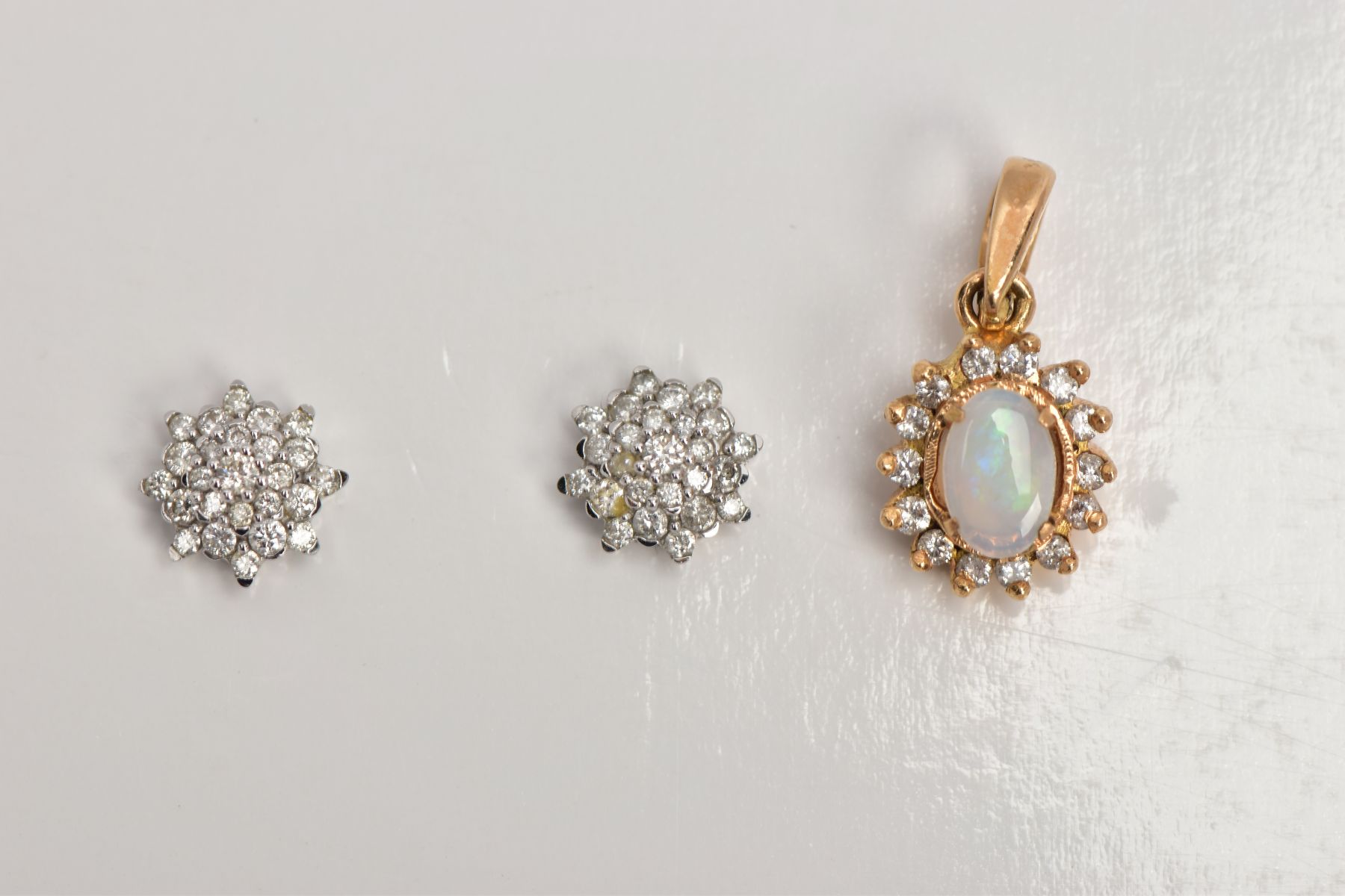 A PAIR OF 9CT WHITE GOLD DIAMOND EARRINGS AND A YELLOW METAL OPAL AND DIAMOND CLUSTER PENDANT,