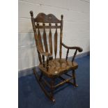 A MODERN OAK ROCKING CHAIR, (condition - scratches to seat and marks to the arms
